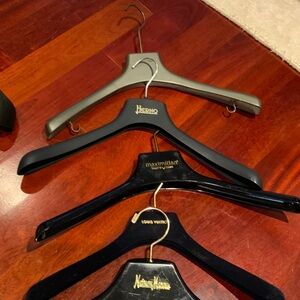 Jacket hangers of designers such as Louis Vuitton/Maximilian/Herno/Fendi